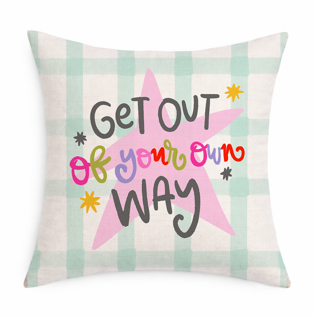 Decorative pillow with a star design and text on a checkered background