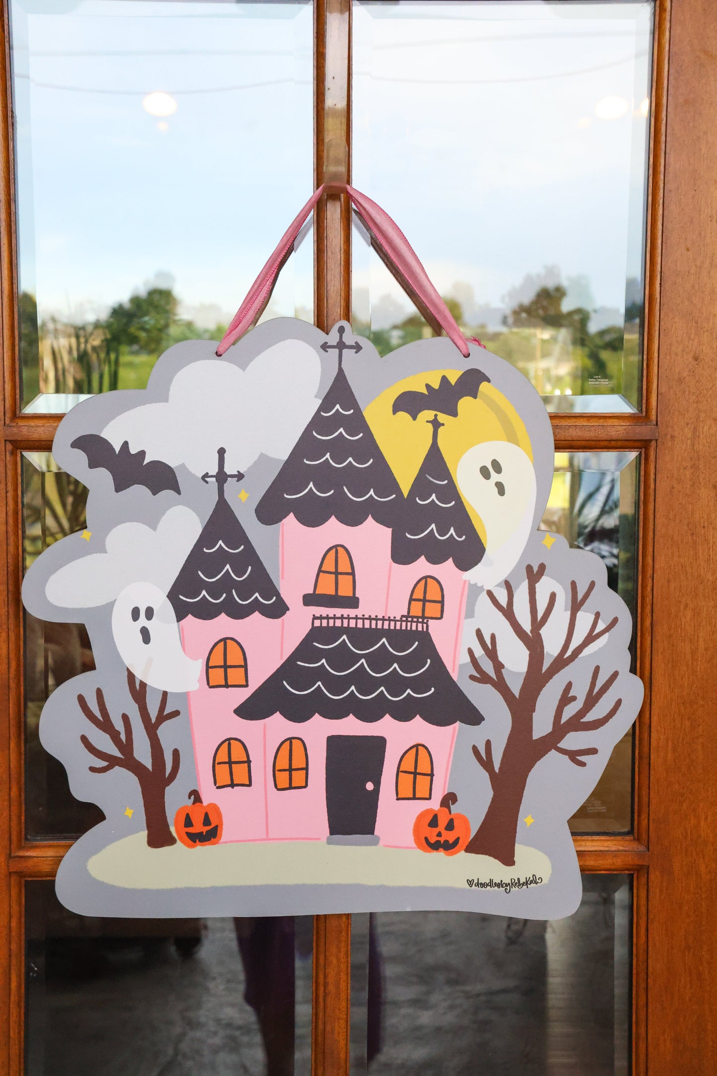 Pink Haunted House with Ghosts Doorhanger