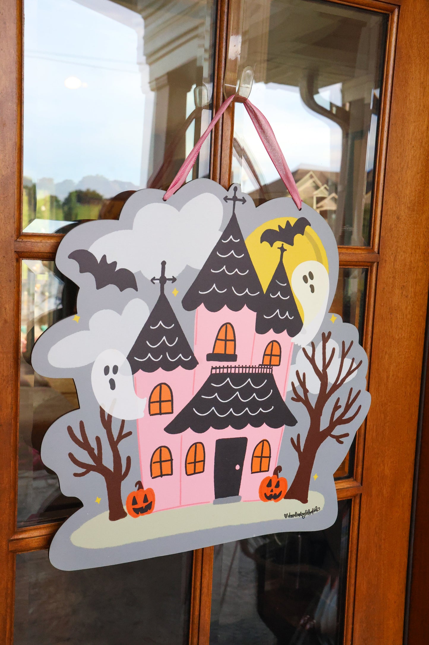 Pink Haunted House with Ghosts Doorhanger