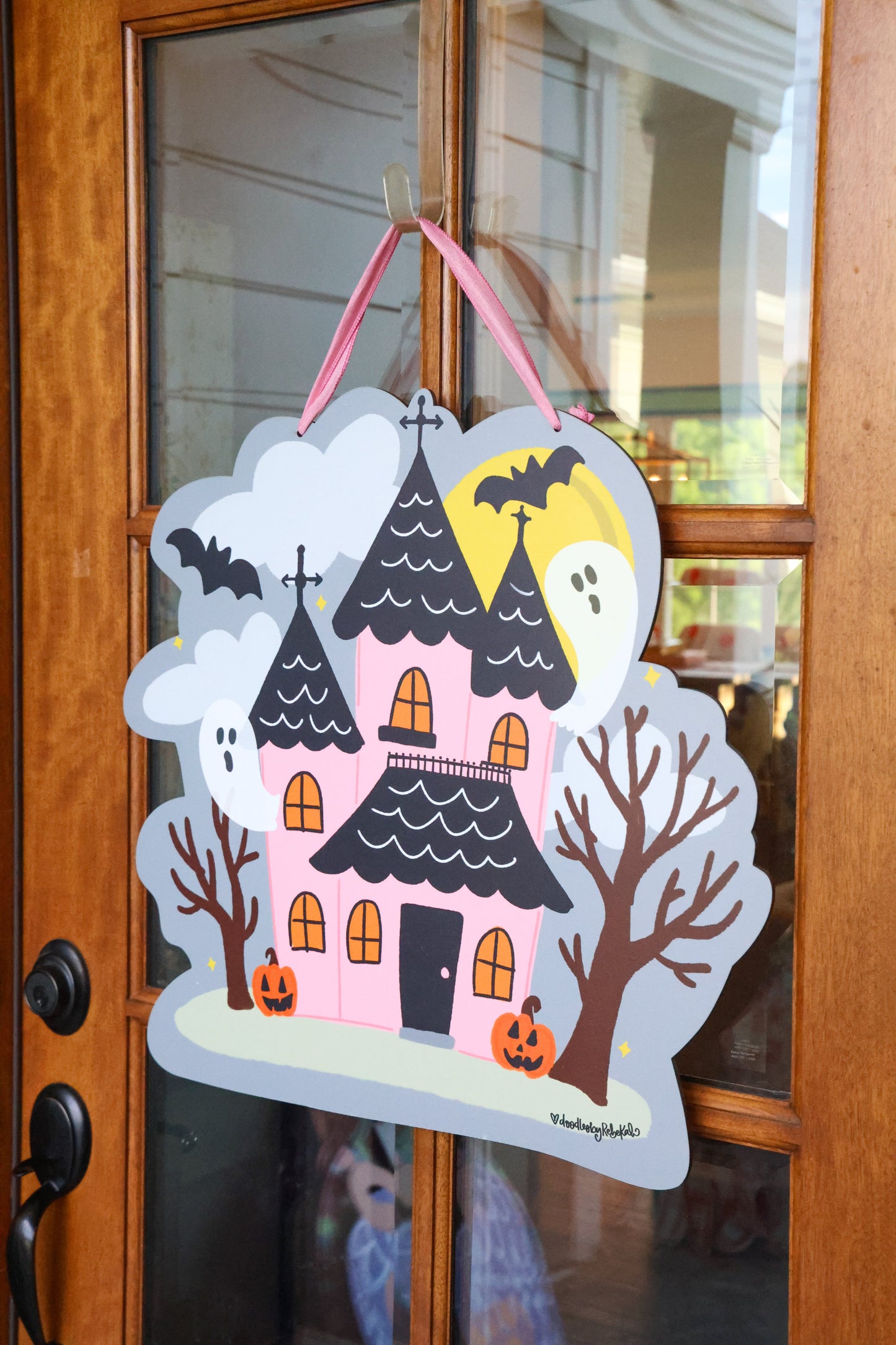 Pink Haunted House with Ghosts Doorhanger
