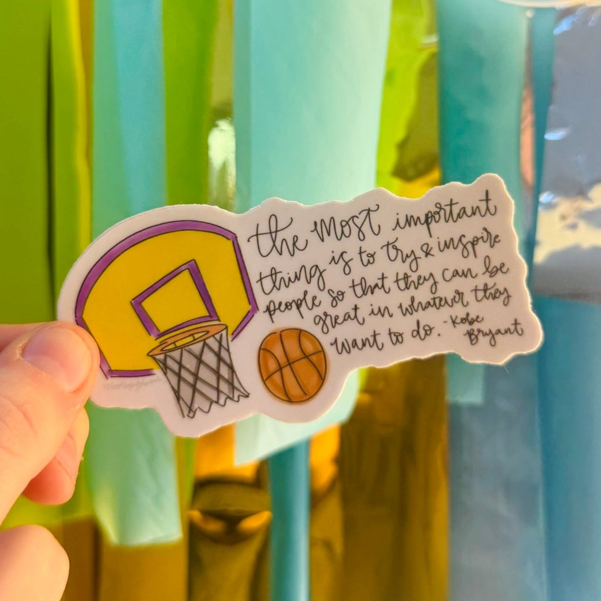 Doodles by Rebekah Kobe Bryant inspirational basketball sticker. This hand-painted die-cut vinyl decal features a motivational sports quote, making it an ideal gift for athletes, coaches, or students to decorate water bottles, laptops, and planners.