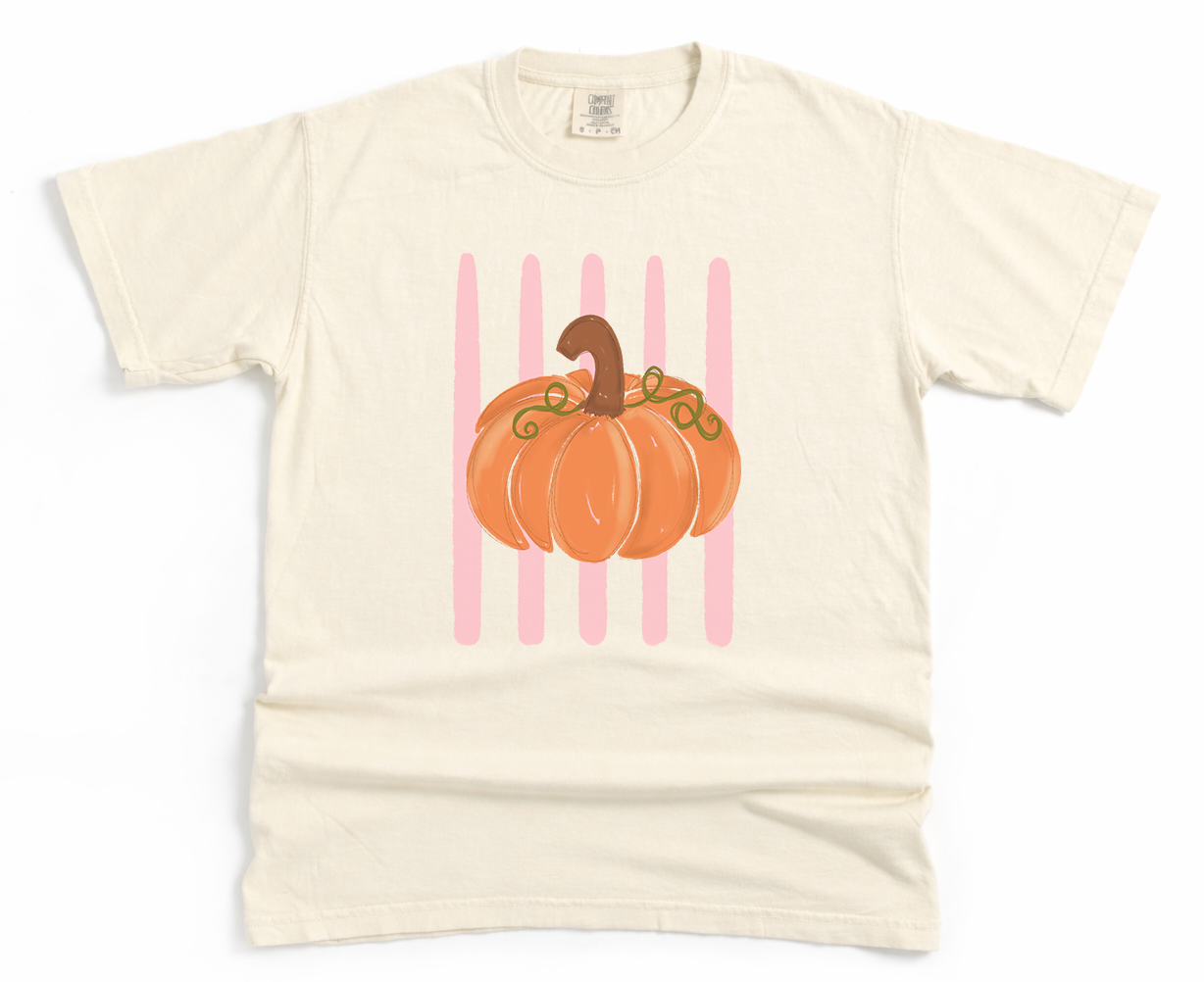 Beige t-shirt with a pumpkin graphic on a white background