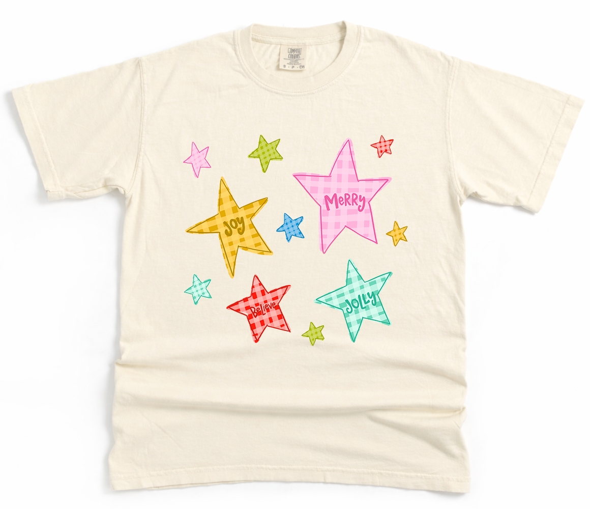 Beige t-shirt with colorful star-shaped text on a white background