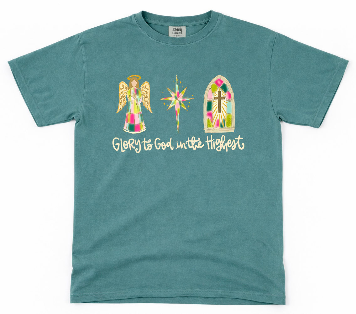 Teal t-shirt with religious graphics and text on a white background