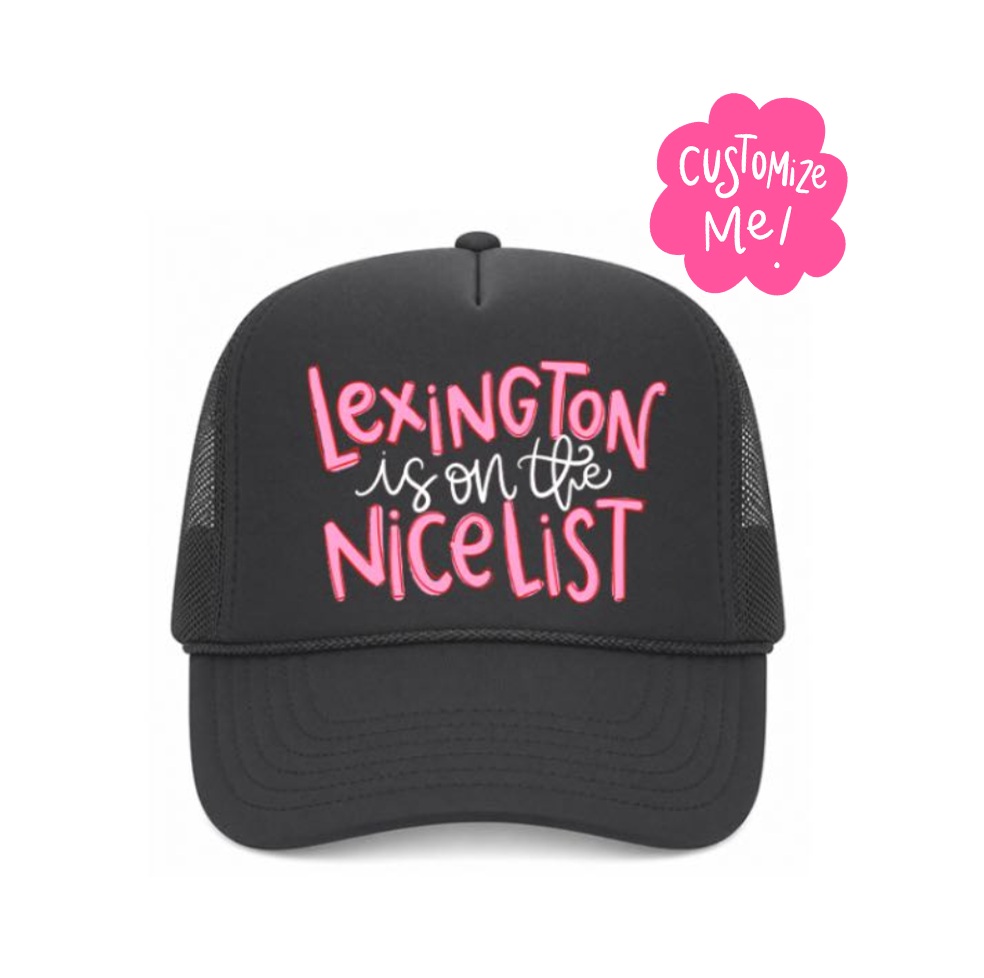 Black cap with pink text 'Lexington is on the nicelist' and a 'Customize Me!' badge on a white background