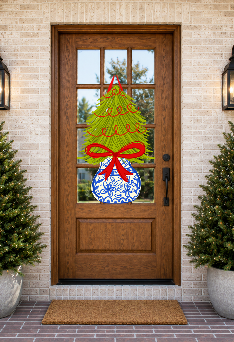 Decorative glass door with Christmas tree design on a brick wall background