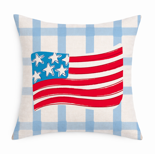 A blue and white gingham pillow with an American Flag