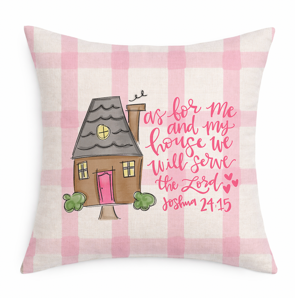 Decorative pillow with a house illustration and text on a pink and white checkered background