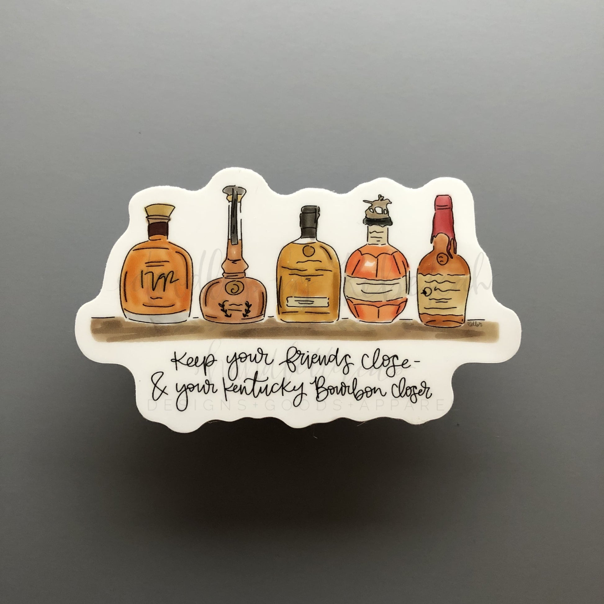 A sticker with an illustration of bourbon bottles and the text 'Keep your friends close & your bourbon closer'.