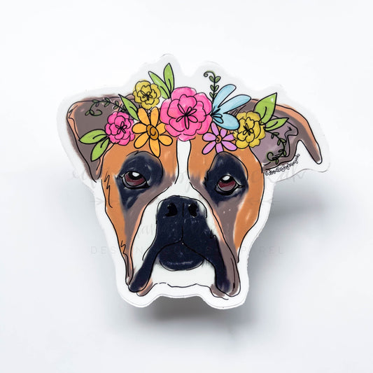 A sticker depicting a colorful illustration of a dog's head with a floral crown made from various flowers.
