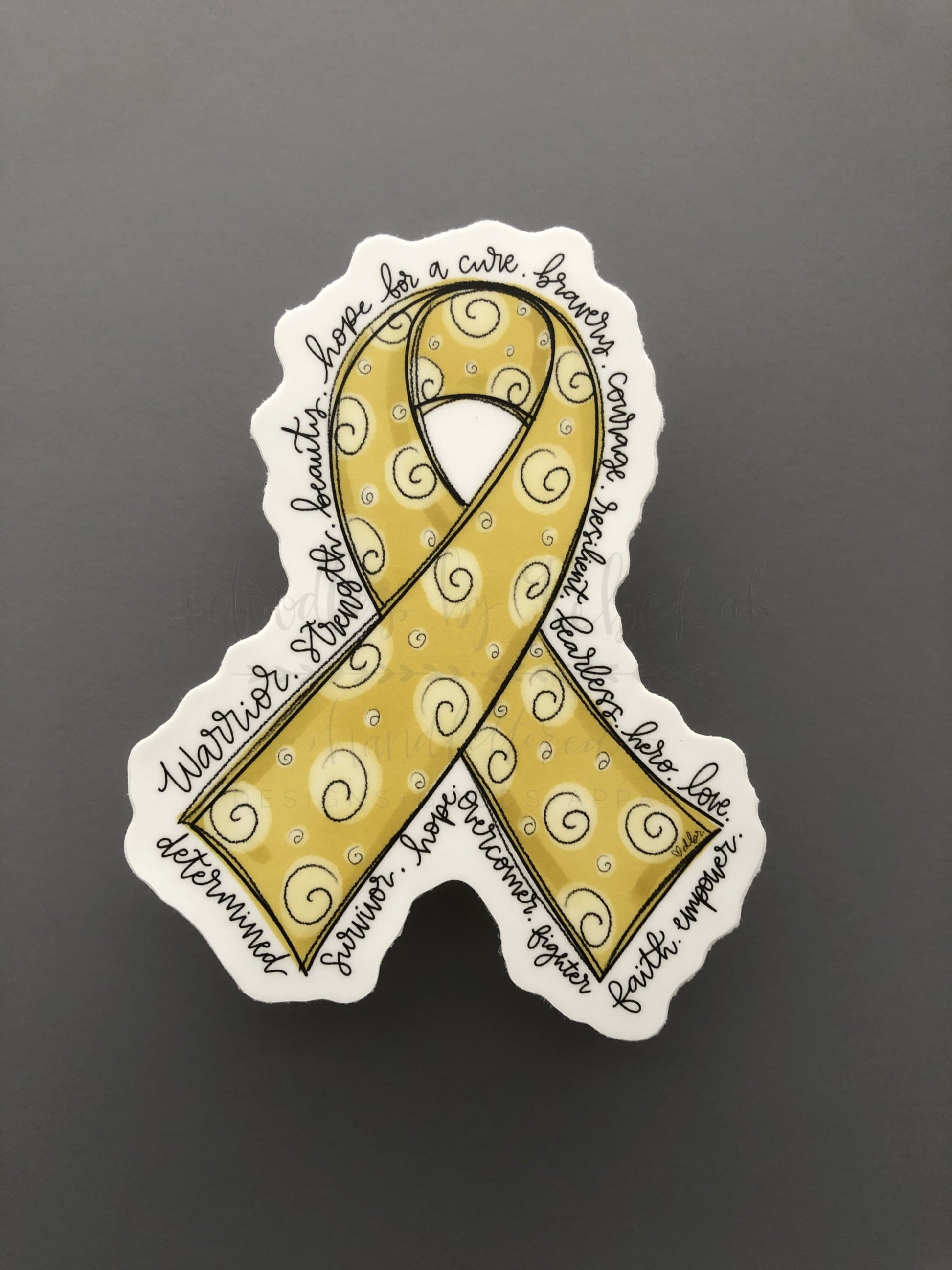 Hand drawn cancer awareness ribbon in Gold