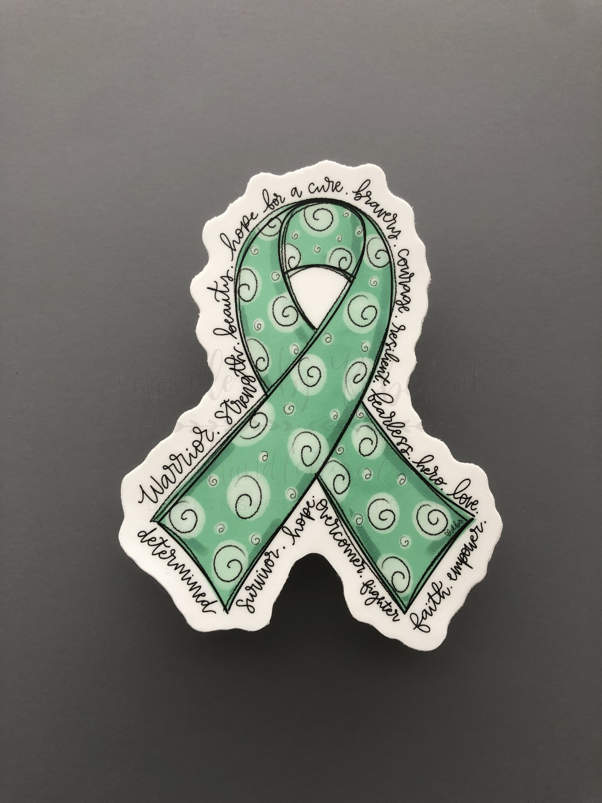 Hand drawn cancer awareness ribbon in Teal