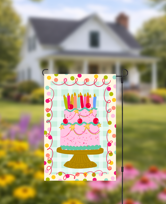 Doodles by Rebekah birthday cake garden flag featuring a whimsical hand-painted pink cake and festive checkered pattern. This vibrant outdoor celebration decor is perfect for yard displays during birthday parties.