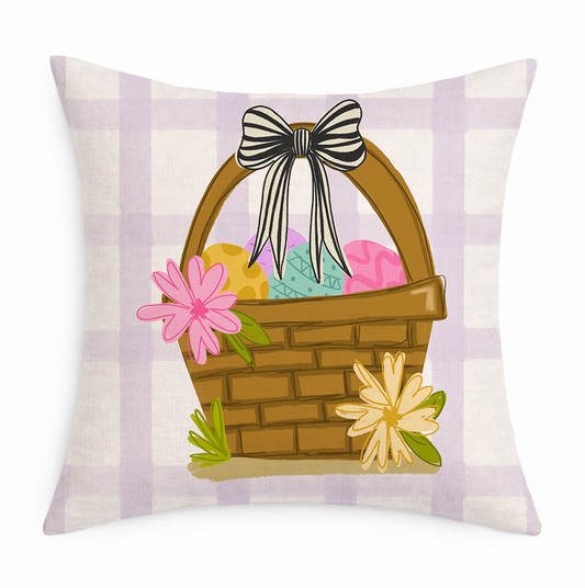 Decorative pillow with Easter basket design featuring eggs, flowers, and a bow on a plaid background.