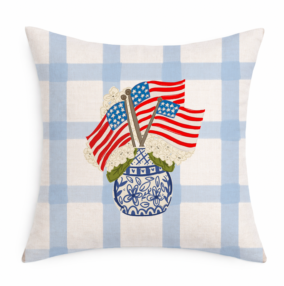 Decorative pillow with American flags, blue vase, and white checkered pattern