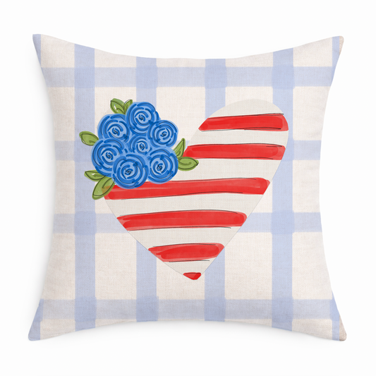 Decorative pillow with blue flowers and red stripes on a plaid background