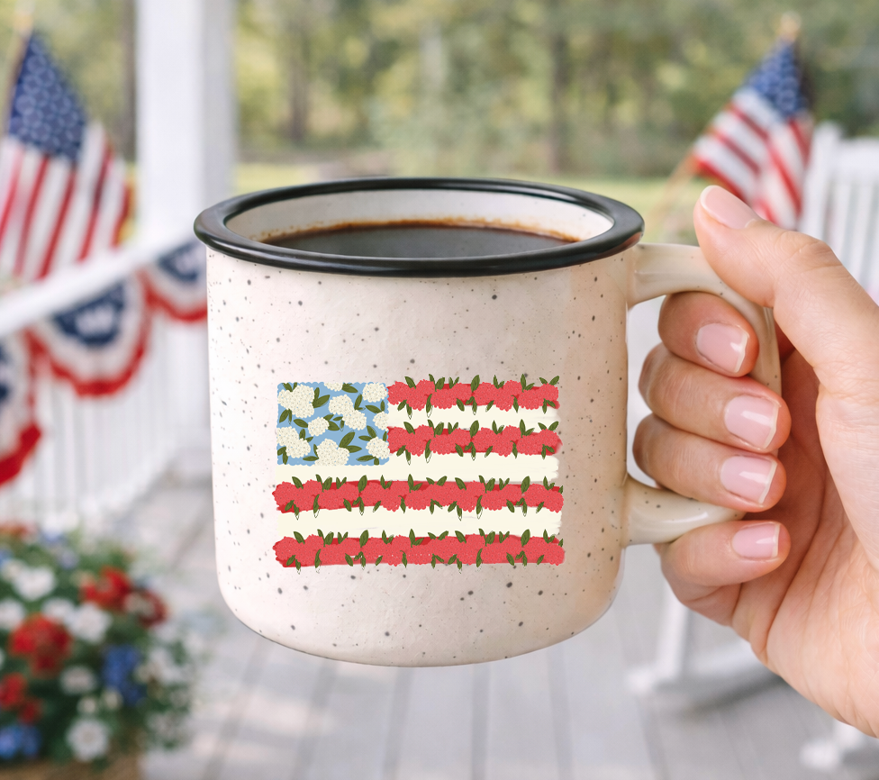 Doodles by Rebekah floral American flag campfire mug. This whimsical hand-painted patriotic coffee cup features a unique botanical take on the US flag, making it a perfect gift for gardeners, farmhouse decor lovers, or 4th of July celebrations.