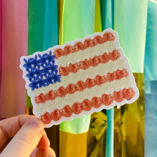 Doodles by Rebekah floral American flag sticker. This whimsical, hand-painted botanical USA flag decal is a perfect patriotic gift for decorating water bottles, laptops, and planners for holidays like the 4th of July or Memorial Day.