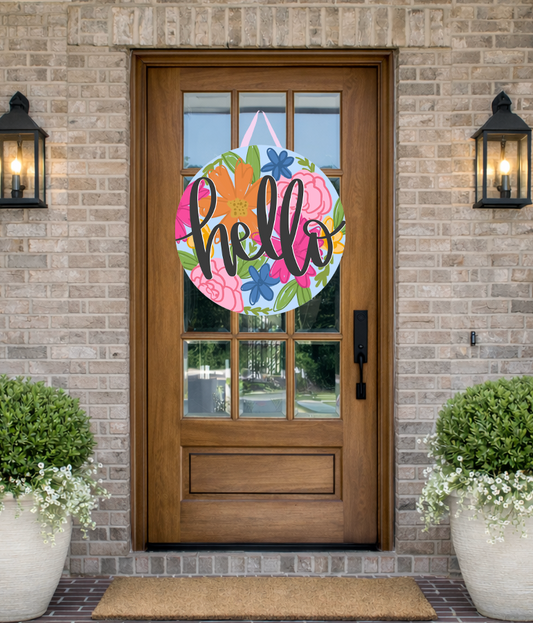 Doodles by Rebekah "Hello" floral door decor featuring a whimsical hand-drawn multi-colored flower pattern on a rustic front porch.