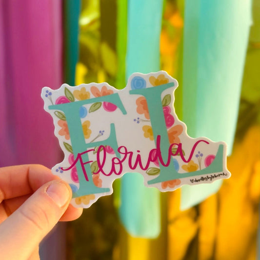 Doodles by Rebekah Florida state pride floral sticker. This whimsical hand-painted vinyl decal with botanical accents and pink cursive lettering is a perfect gift for Floridians to decorate water bottles, laptops, and planners.