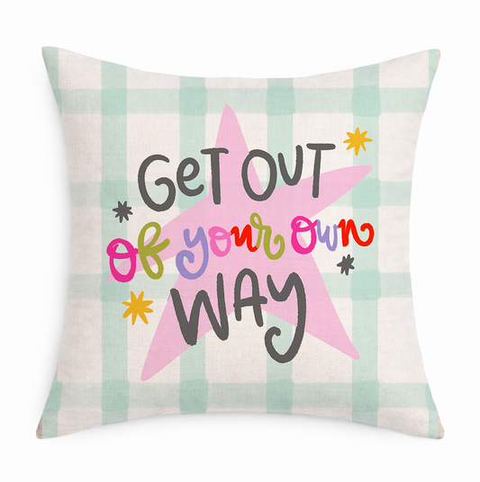 Decorative pillow with a star design and text on a checkered background
