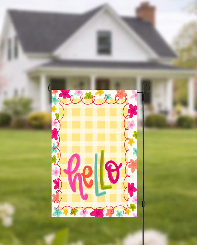 Doodles by Rebekah "Hello" floral garden flag featuring whimsical hand-painted typography and a yellow checkered pattern. This vibrant outdoor seasonal decor is perfect for welcoming guests to a front yard, garden, or porch.