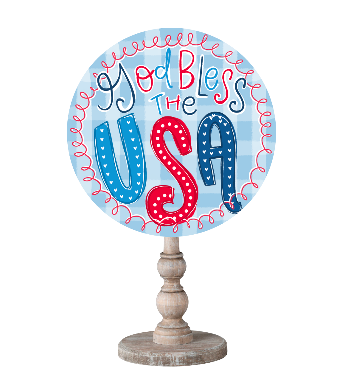 A circle topper with a blue and white plaid background that reads "God Bless the USA" on a wooden dowel holder