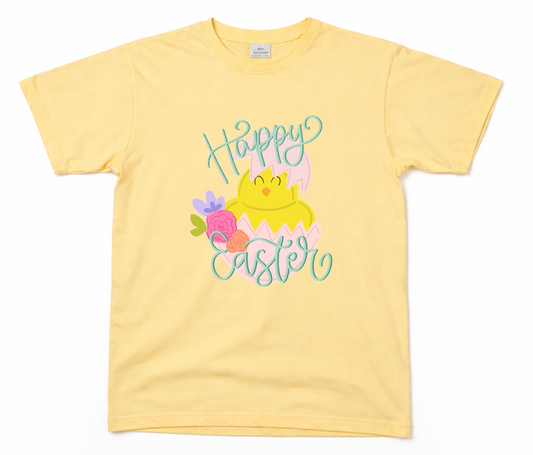 Yellow t-shirt with 'Happy Easter' design featuring a chick and flowers on a white background