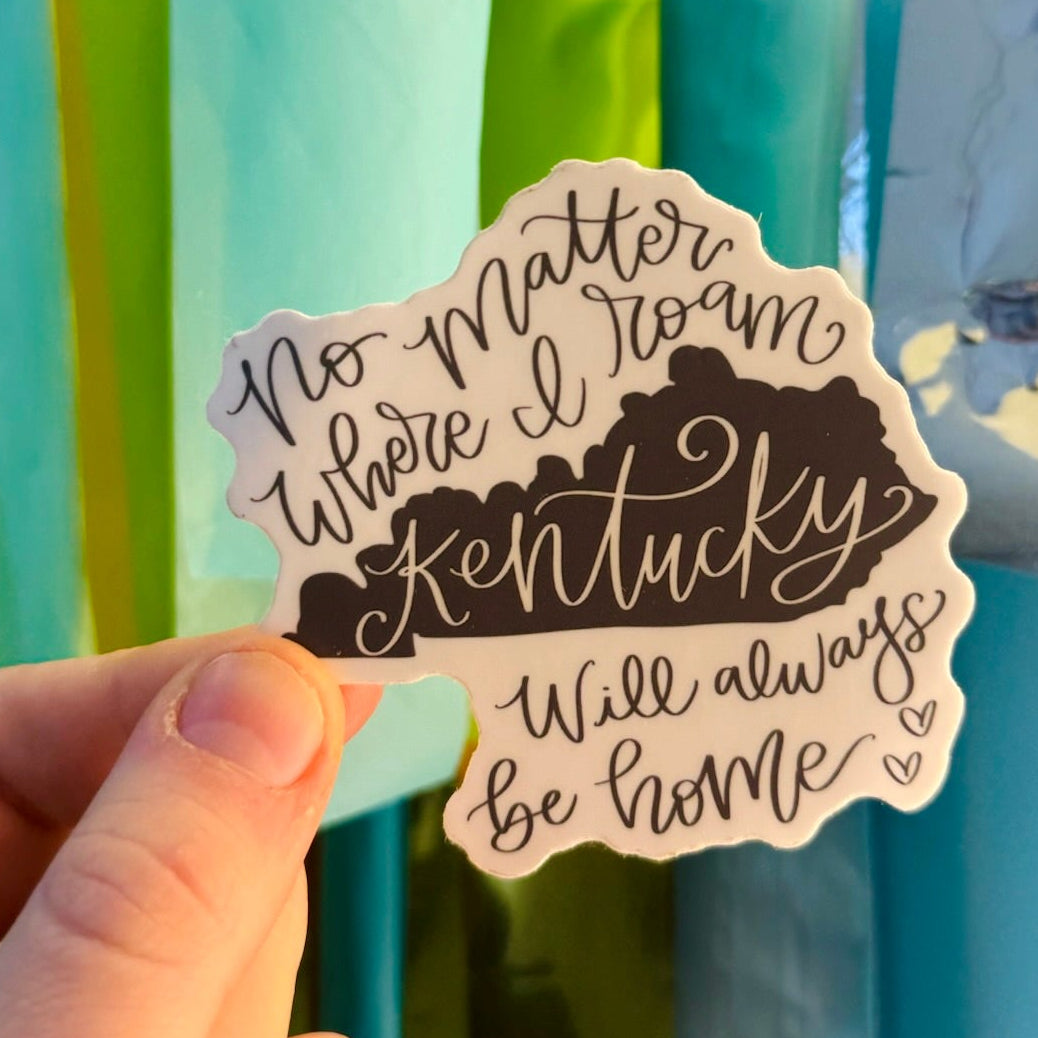 Doodles by Rebekah "Kentucky Will Always Be Home" vinyl sticker. This whimsical hand-painted state pride decal features a sentimental quote and KY silhouette, making it a perfect gift for Kentuckians to decorate water bottles, laptops, and planners.