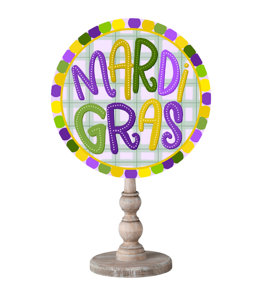 Purple, Green, and Yellow decorative topper on a wooden dowel that reads "Mardi Gras"