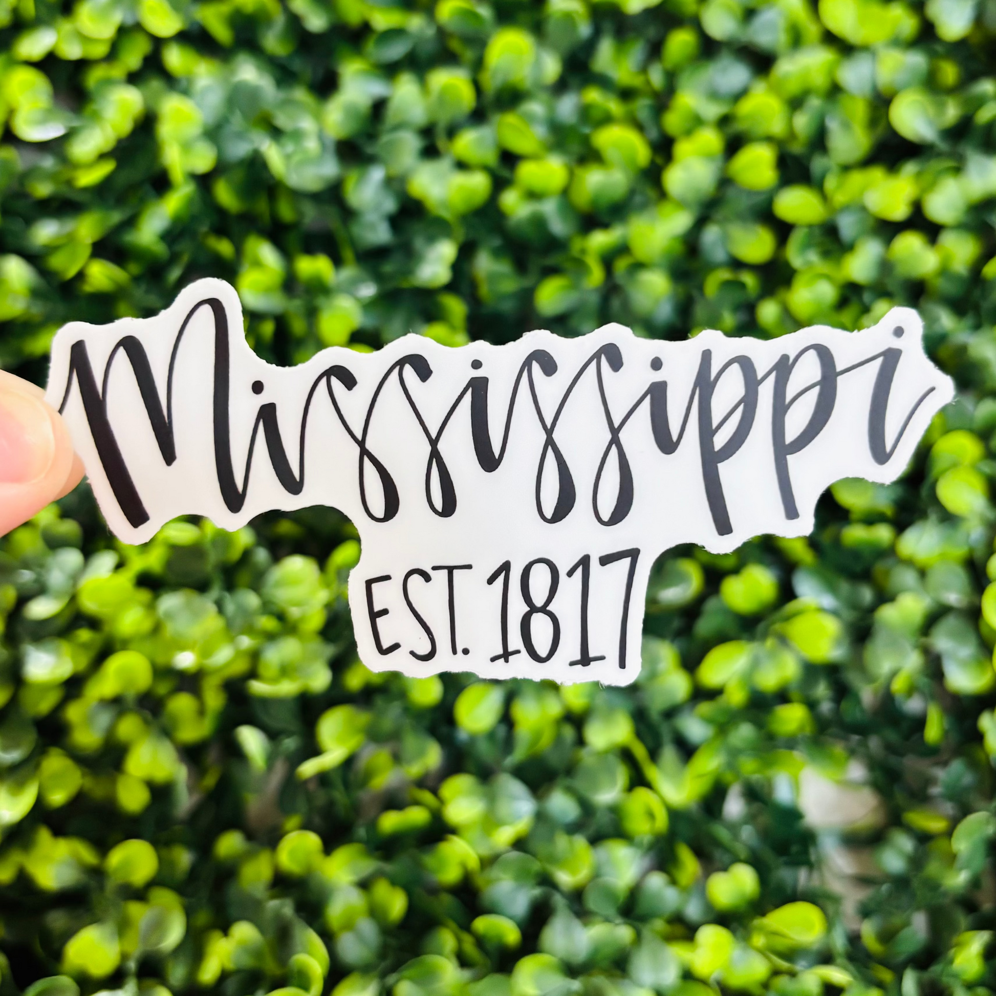 A black and white sticker that reads "Mississippi Est. 1817"