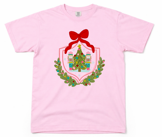 Pink t-shirt with Christmas-themed graphic on a white background