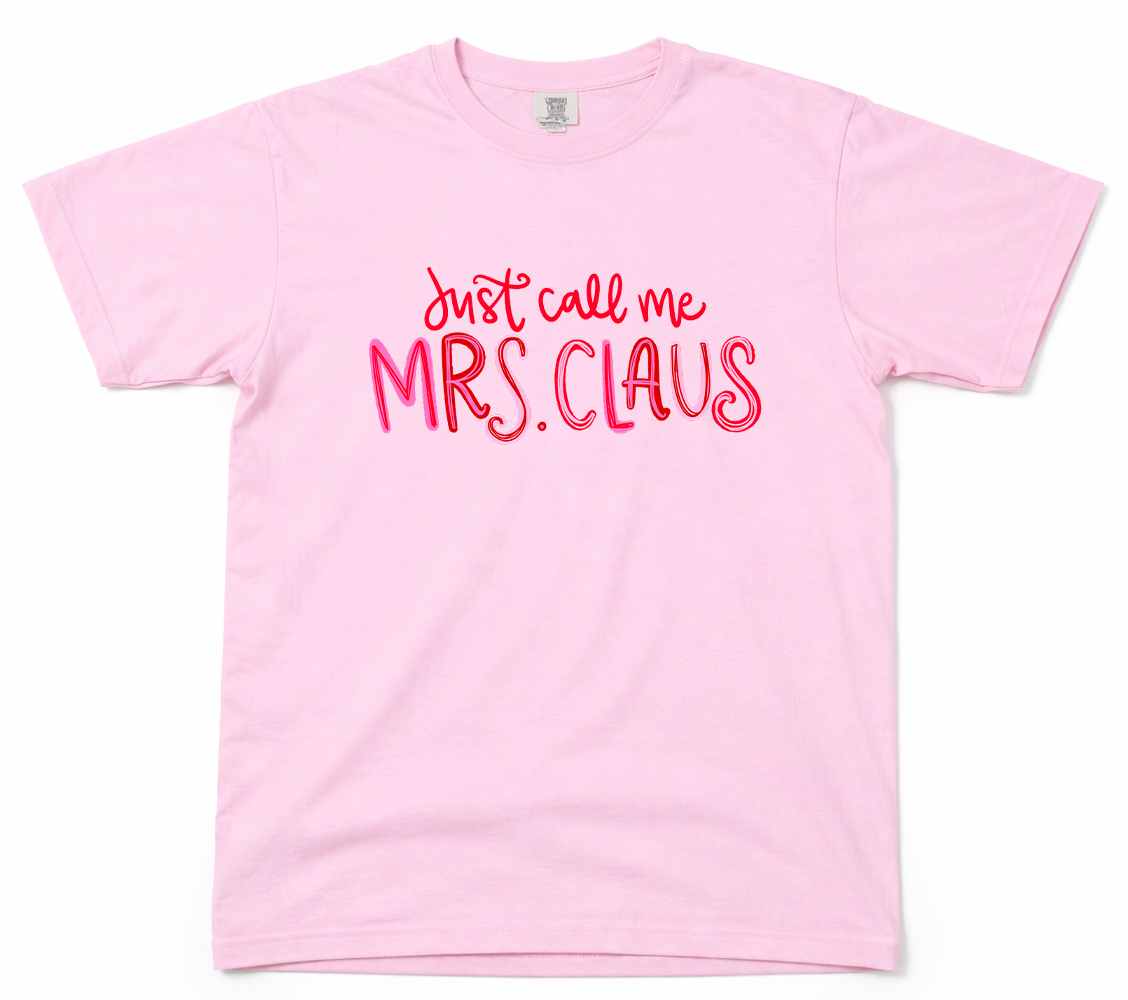 Pink t-shirt with 'Just call me Mrs. Claus' text on a white background