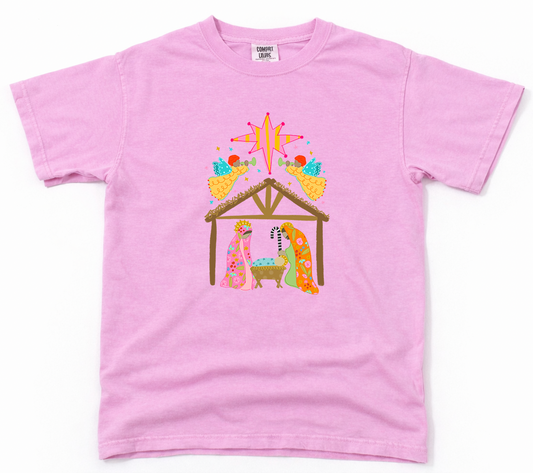 Pink t-shirt with a nativity scene design on a white background