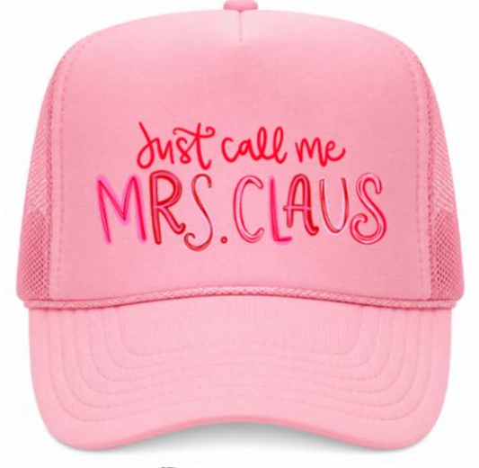 Pink trucker hat with 'Just call me Mrs. Claus' text on a white background