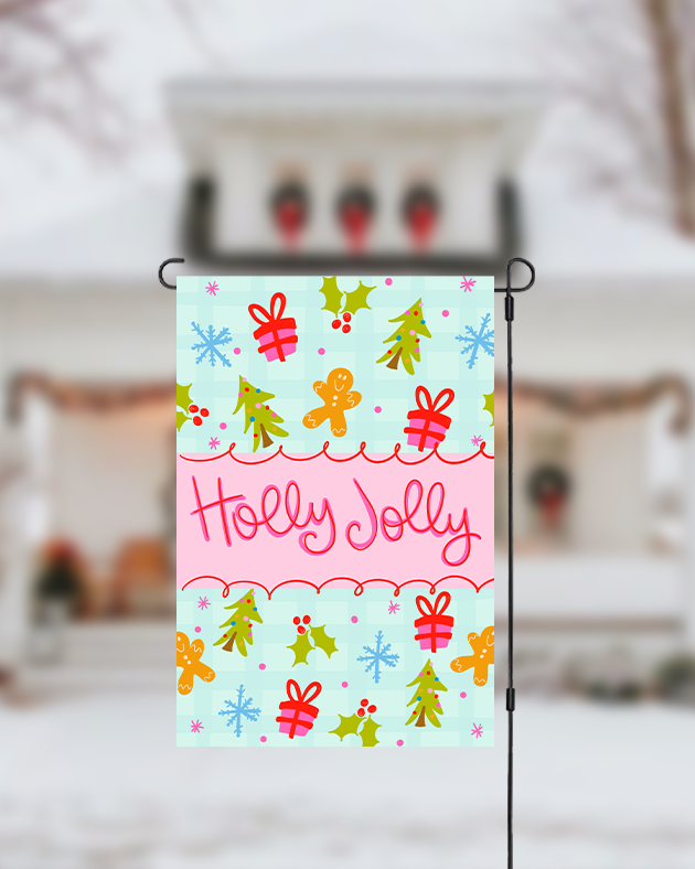 Decorative garden flag with Christmas designs and 'Holly Jolly' text, displayed outdoors.