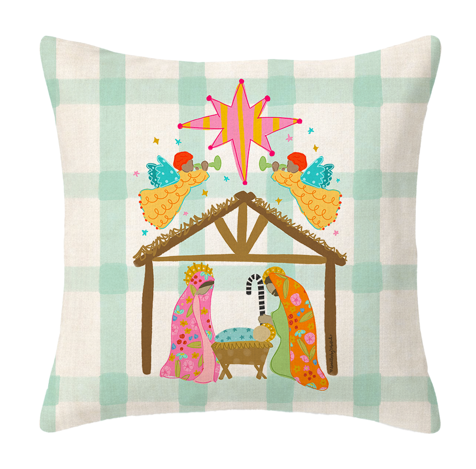 Decorative pillow with a nativity scene design on a plaid background