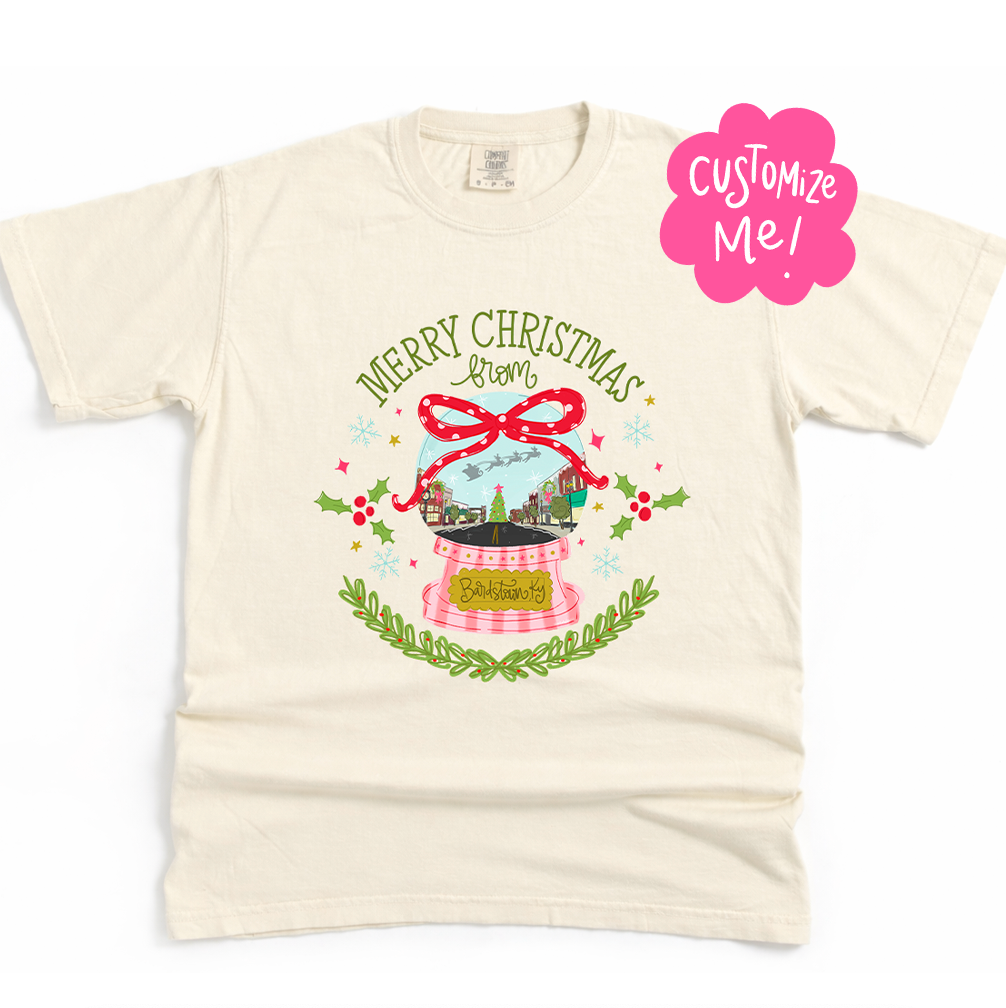 Beige t-shirt with Christmas-themed design and 'Customize Me!' text on a white background