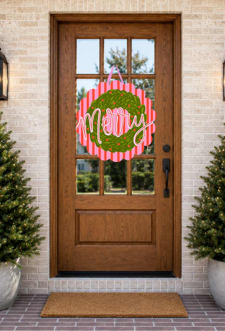 Decorative wreath with 'Merry' text on a wooden door with festive plants.