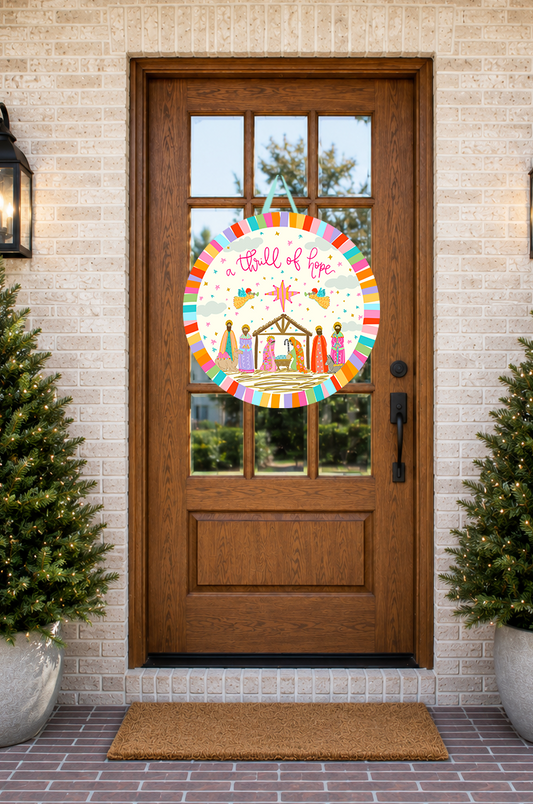 Decorative door decal with nativity scene design on a wooden door with brick wall background