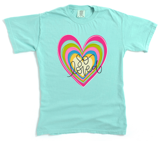 Light blue t-shirt with a colorful heart design and 'So Sweet' text on a white background