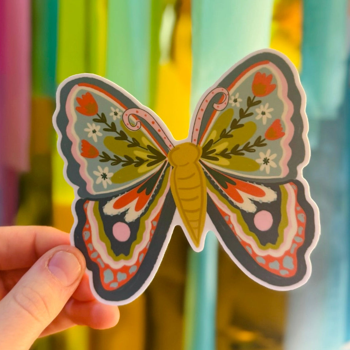 Doodles by Rebekah whimsical floral butterfly sticker. This hand-painted botanical butterfly decal is a perfect nature-inspired gift for decorating water bottles, laptops, and journals.
