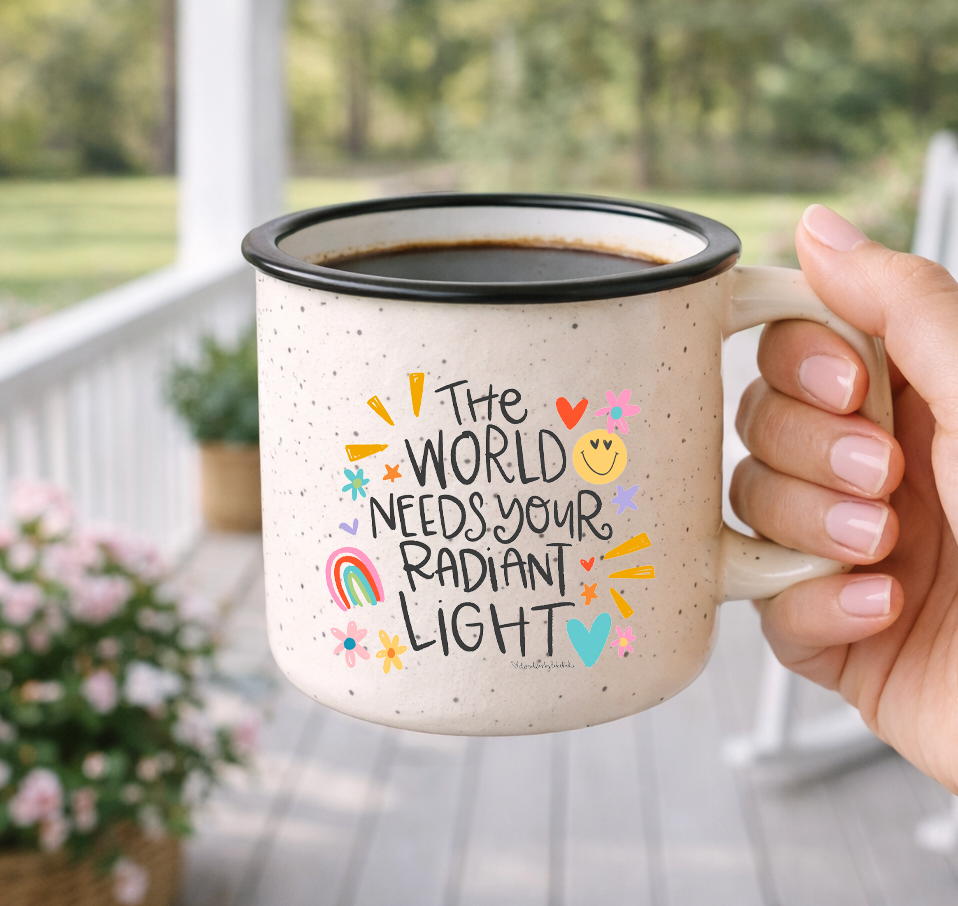 Doodles by Rebekah "Radiant Light" inspirational mug. This whimsical hand-painted ceramic coffee cup features positive typography and colorful sun, heart, and rainbow accents, making it an ideal gift for encouragement, graduation, or spreading kindness.