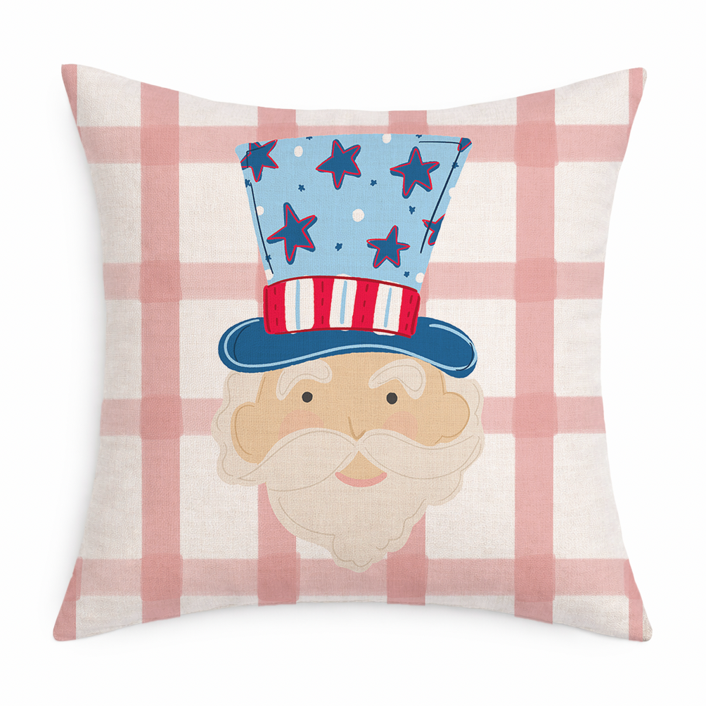 Decorative pillow with a face design and American flag hat on a pink and white checkered background