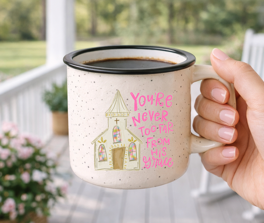 Doodles by Rebekah "You're Never Too Far From His Grace" religious mug. This whimsical hand-painted ceramic coffee cup features a charming church illustration and serves as an encouraging faith-based gift for friends, family, or church members.